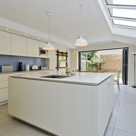 Cook up a feast in the sleek kitchen, which opens out onto the garden