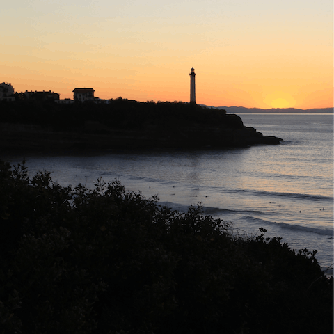 Watch the sunset over the Atlantic from the lighthouse