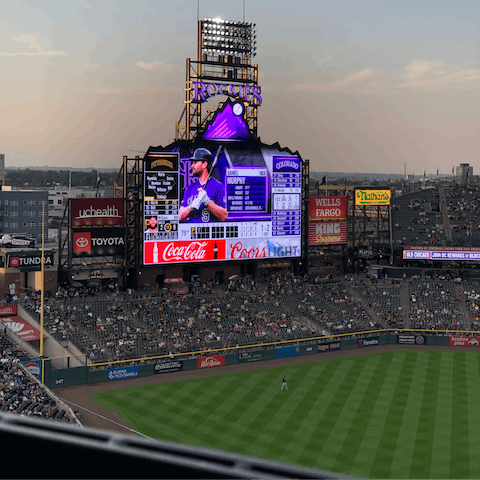 Catch a ball game at Coors Field, half a mile from your apartment