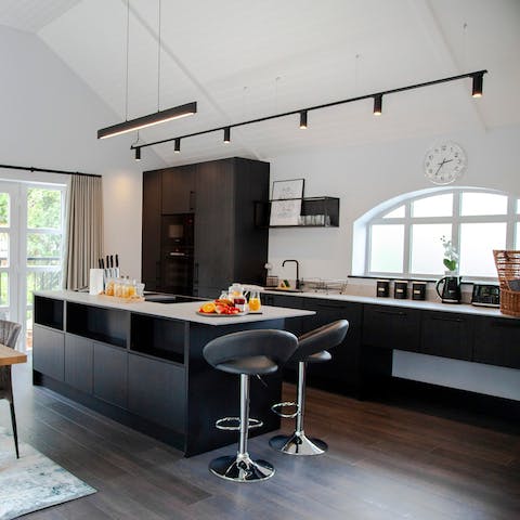 Make the most of the large kitchen island, so you can juggle cooking with entertaining