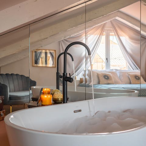 Take a soak in the luxurious bathtub as you unwind after a day in the city