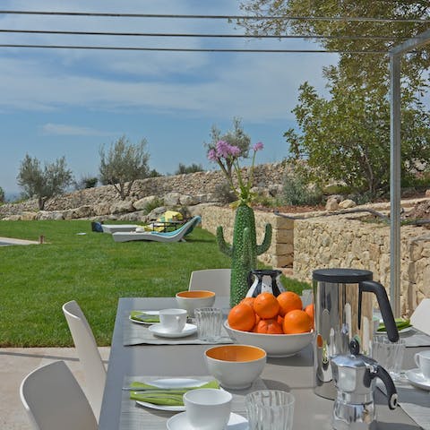 Tuck into a Sicilian feast on the sun-dappled terrace