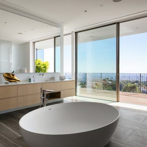 Have a relaxing soak in the freestanding bathtub