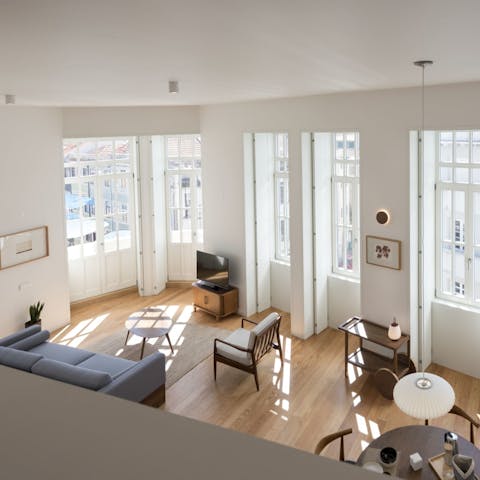 Admire the high ceilings and pretty windows in the spacious living area