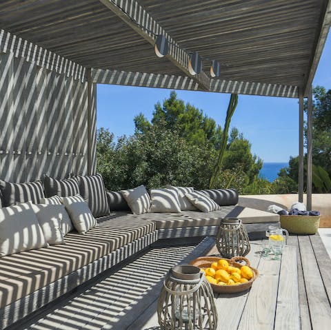 Retreat from the midday sun and catch a few dreamy hours on the shady day bed