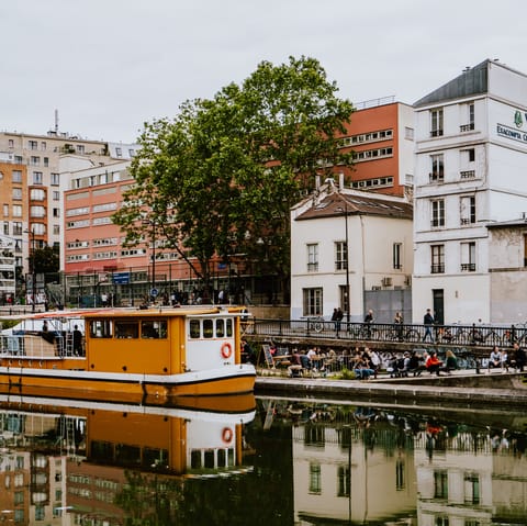 Stroll along the Canal Saint-Martin, fifteen minutes on foot from your door