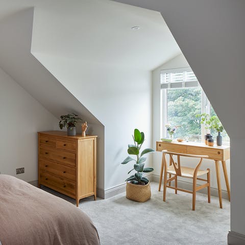 Use the bedroom desk as a little workspace with leafy views