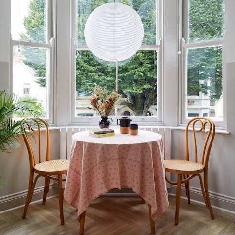 Plan your city break at the dining table, nestled in a bay window