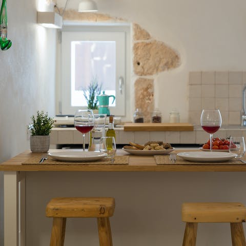 Enjoy a glass of Primitivo in your light-filled kitchen