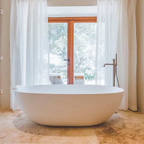 End the evening with a luxurious soak in the freestanding bathtub