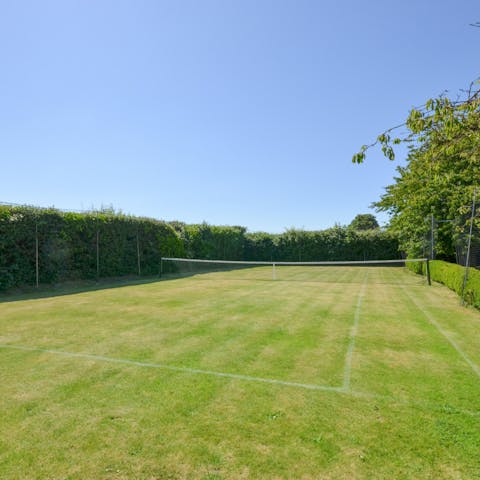 Tuck in to strawberries and cream after a hard-fought match out on the grass tennis court