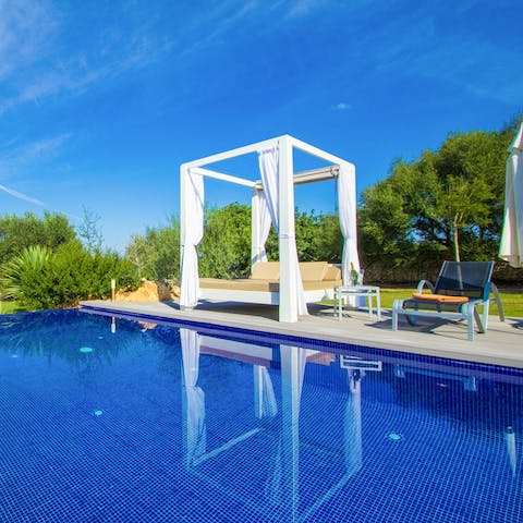 Enjoy a quick siesta by the poolside after swimming a few lengths