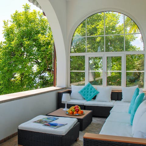 Relax on the covered terrace, the perfect spot for an afternoon nap