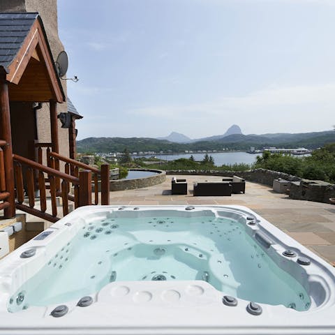 Enjoy a luxurious soak in the hot tub as you take in the wonderful views 