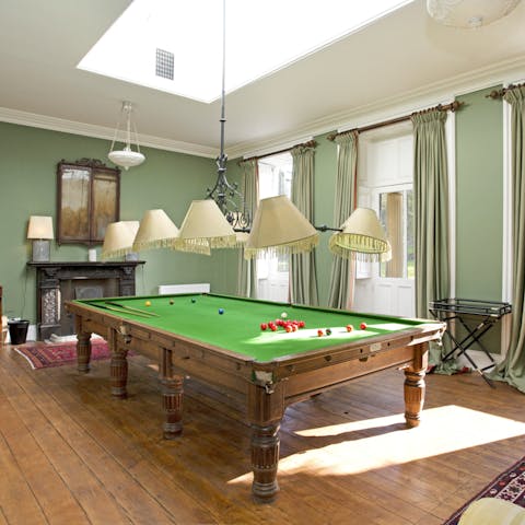 Play an exciting game of billiards in the recreation room