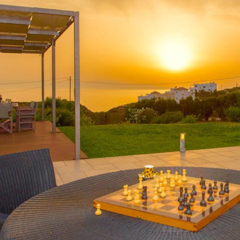 Play a friendly game of chess as the sun goes down
