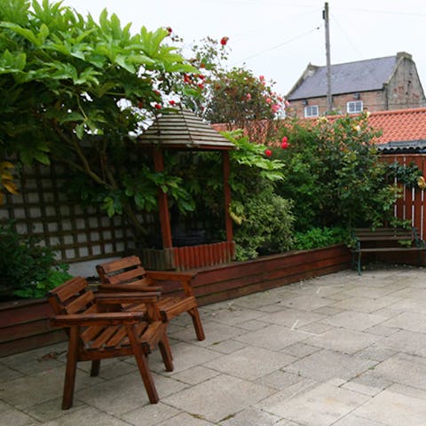 Enjoy a quiet summer evening in the courtyard garden, watching the sun go down