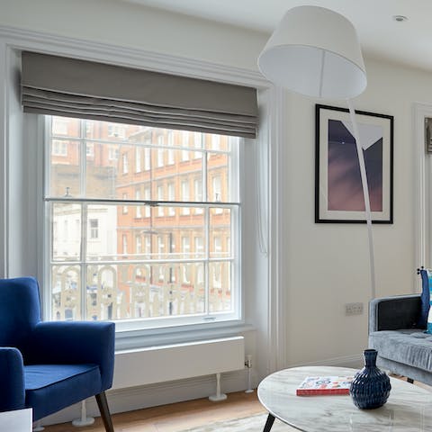 Sit by the huge windows and look out towards classic red-brick buildings