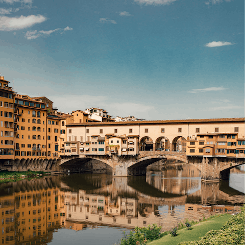 Admire the medieval Ponte Vecchio, a short stroll away