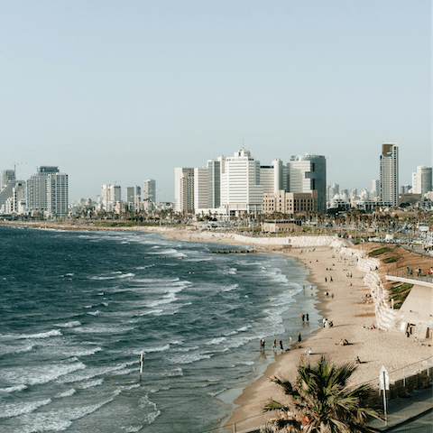 Soak up the sun from the golden sands of Aviv Beach, a few steps away