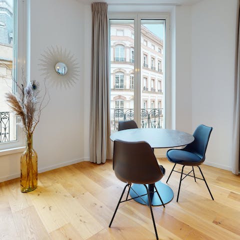 Start your mornings with coffee and croissants at the window-side dining table