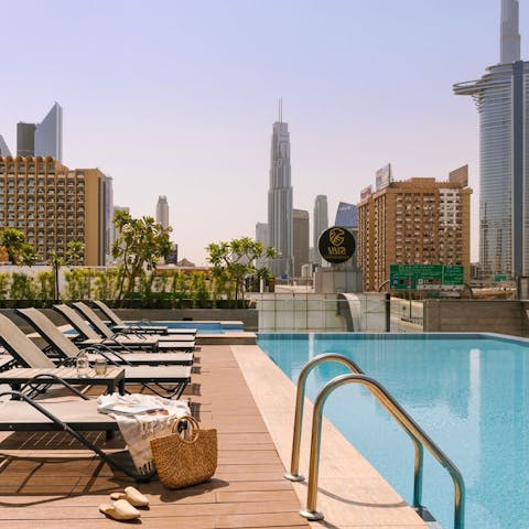Cool off from the Dubai sun in the communal outdoor pool with its stunning skyline views 