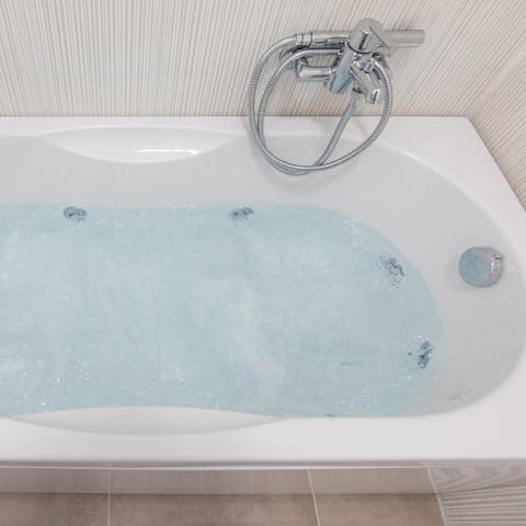Unwind after a long day on your feet with a soak in the jacuzzi bathtub