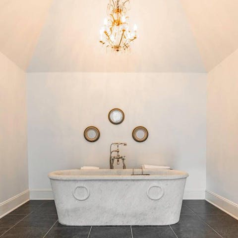 Wind down in your stunning stone tub