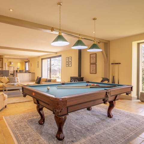 Play a match or three of pool with the wood-burning stove crackling in the background