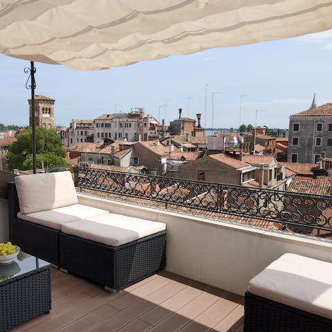 Survey the city skyline with a glass of wine in hand from your private roof terrace