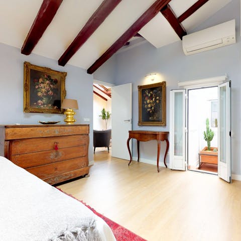 Admire the home's vaulted ceilings and mix of antique and contemporary furniture