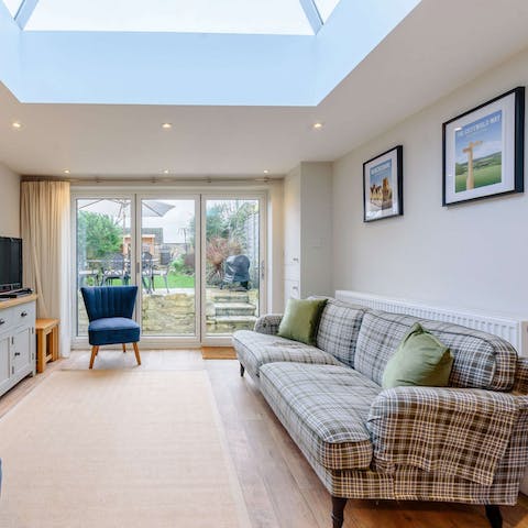 Sprawl out on the sofa underneath the glass lantern roof, the perfect place to watch a movie or play a board game