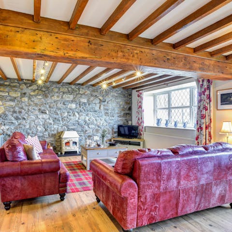 Relax in cosy, characterful surroundings complete with beamed ceilings and wood burning stove