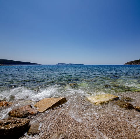 Take a dip in the Adriatic Sea at Špadići Beach, half an hour away by car
