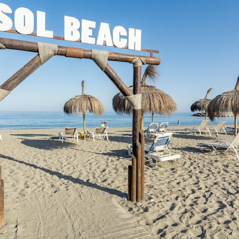 Take a short drive or a fifteen-minute walk down to the sandy  Sol Beach