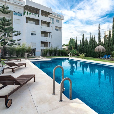 Soak up the sun by the communal pool or take a refreshing dip 