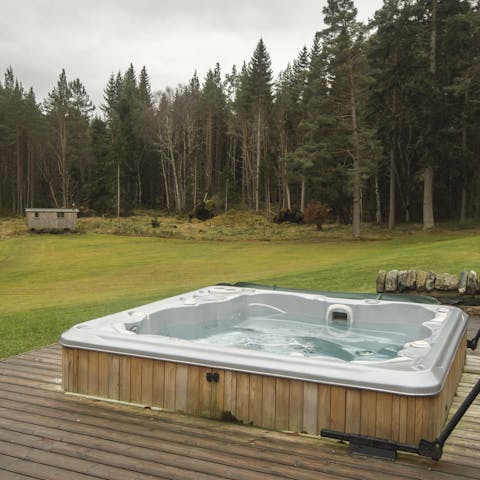 Sink into the hot tub after a day exploring the grounds