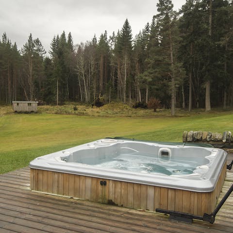 Sink into the hot tub after a day exploring the grounds