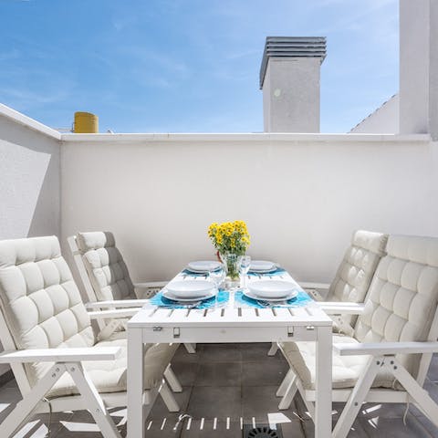 Dine outside on one of the apartment's two private terraces