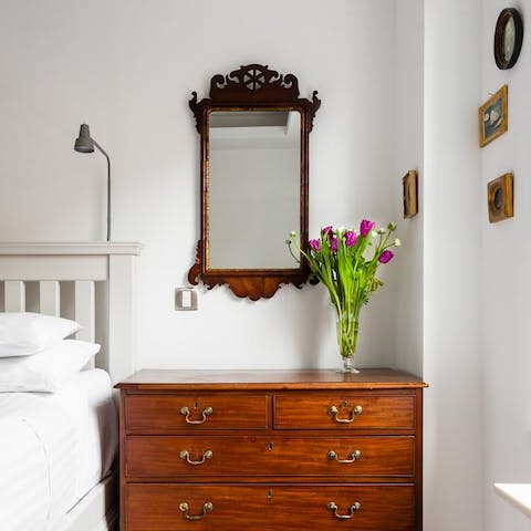 Admire the antique furniture in the bedroom