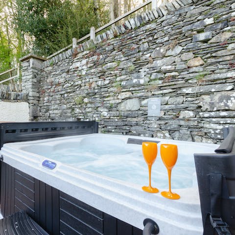 Soak away the evening in your outdoor hot tub under the stars with a glass of fizz