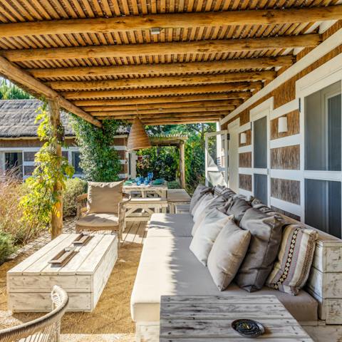 Sip coffee or a glass of wine under the shade of the pergola