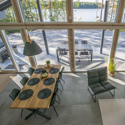 Dine inside with a view of the lake through the window or out on the terrace with the barbecue smoking away