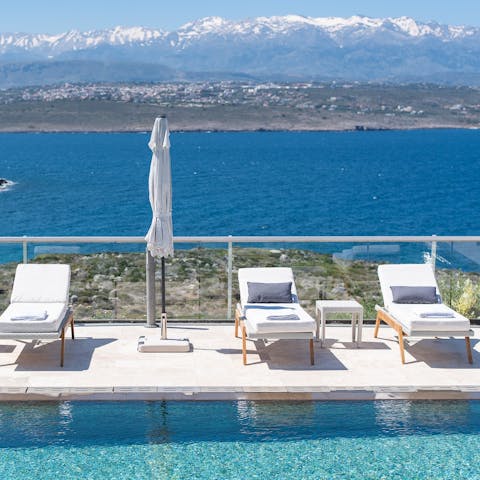 Hit the pool deck with a cocktail and soak in the panoramic views of the mountains and sea