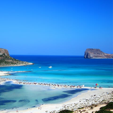 Experience the immaculate white sand beaches and crystal clear waters that Greece is famous for