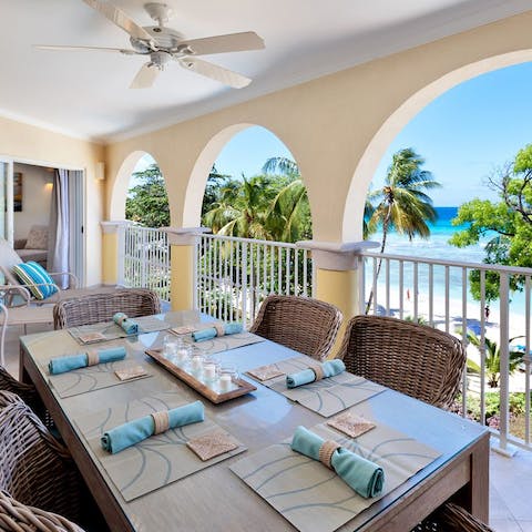 Dine on the verandah with a rather fabulous view of the Caribbean Sea for company