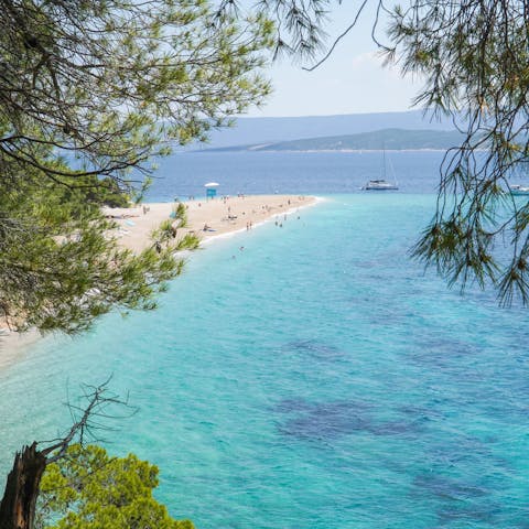 Sail over the island of Brač and spend a day enjoying the spectacular surroundings of Zlatni Rat beach