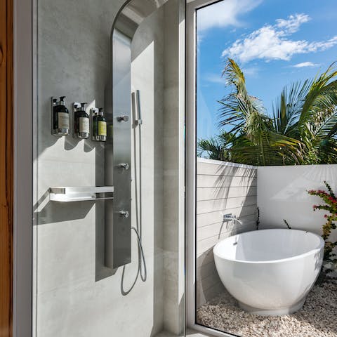 Treat yourself to an indulgent soak in the outdoor bathtub