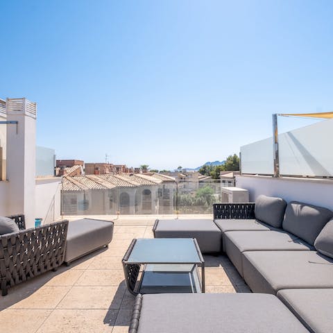 Serenade the evening sun with sangrias on the private rooftop terrace