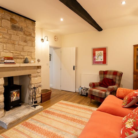 Keep cosy in front of the wood-burning stove on a grey afternoon